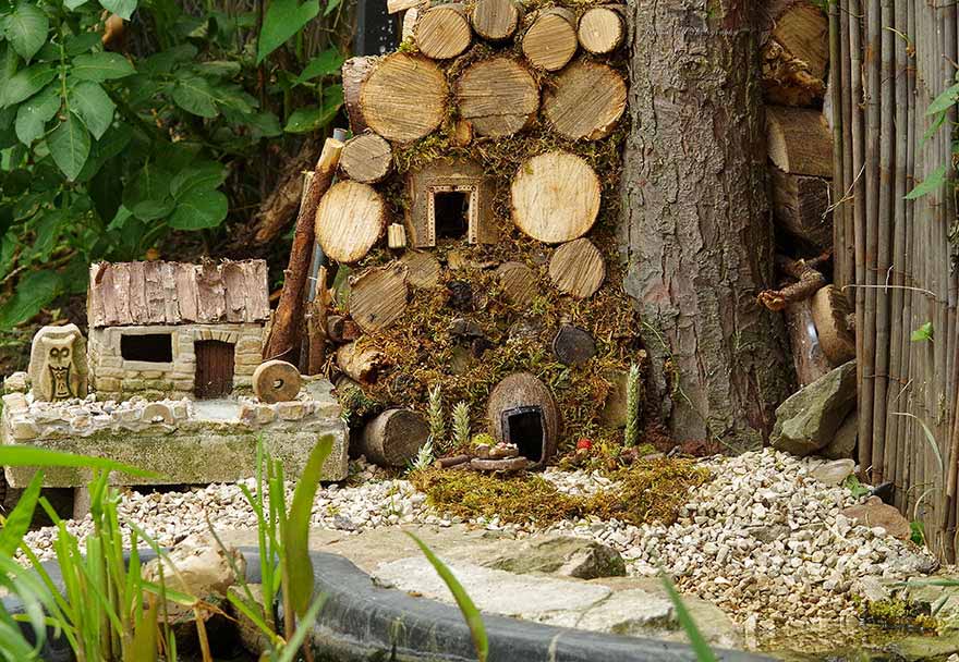 photographer builds a tiny village for a mouse he found in his yard