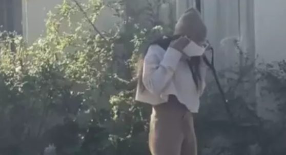 mia khalifa 'caught' picking up poo with mask before putting it back on