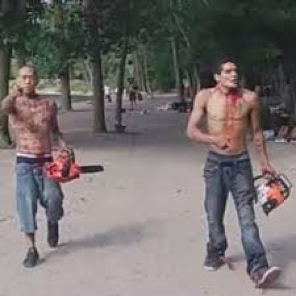 blood-covered men armed with chainsaws tell beachgoers 'you're f****d'