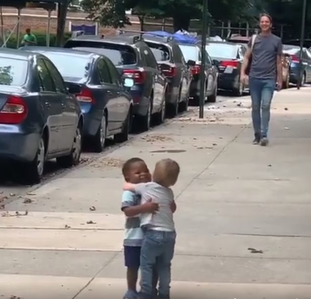 adorable moment as two-year-old best friends run to hug each other on the street after two days apart