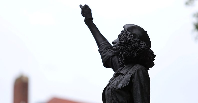 black lives matter protester replaces torn down slave trader edward colston statue in bristol