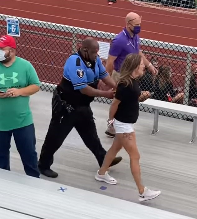 video: ohio mother arrested and tased for not wearing mask at son's middle school football game held outside