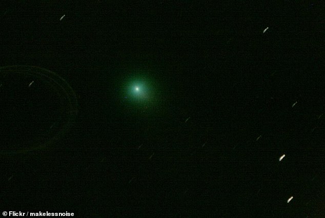 once-in-a-lifetime brilliant green comet with 10 million-mile-long tail flies past earth