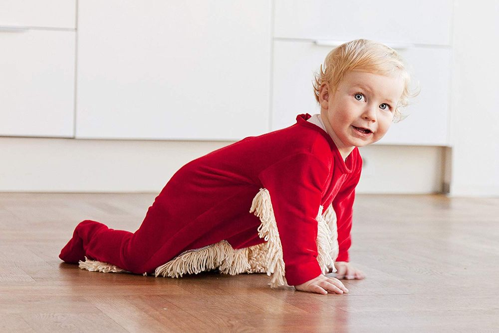 this baby bodysuit with built-in mop hilariously lets little ones help with the cleaning while they crawl around