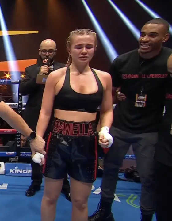 Controversy Erupts As Female Boxer Lifts Top In Celebration Of First Win